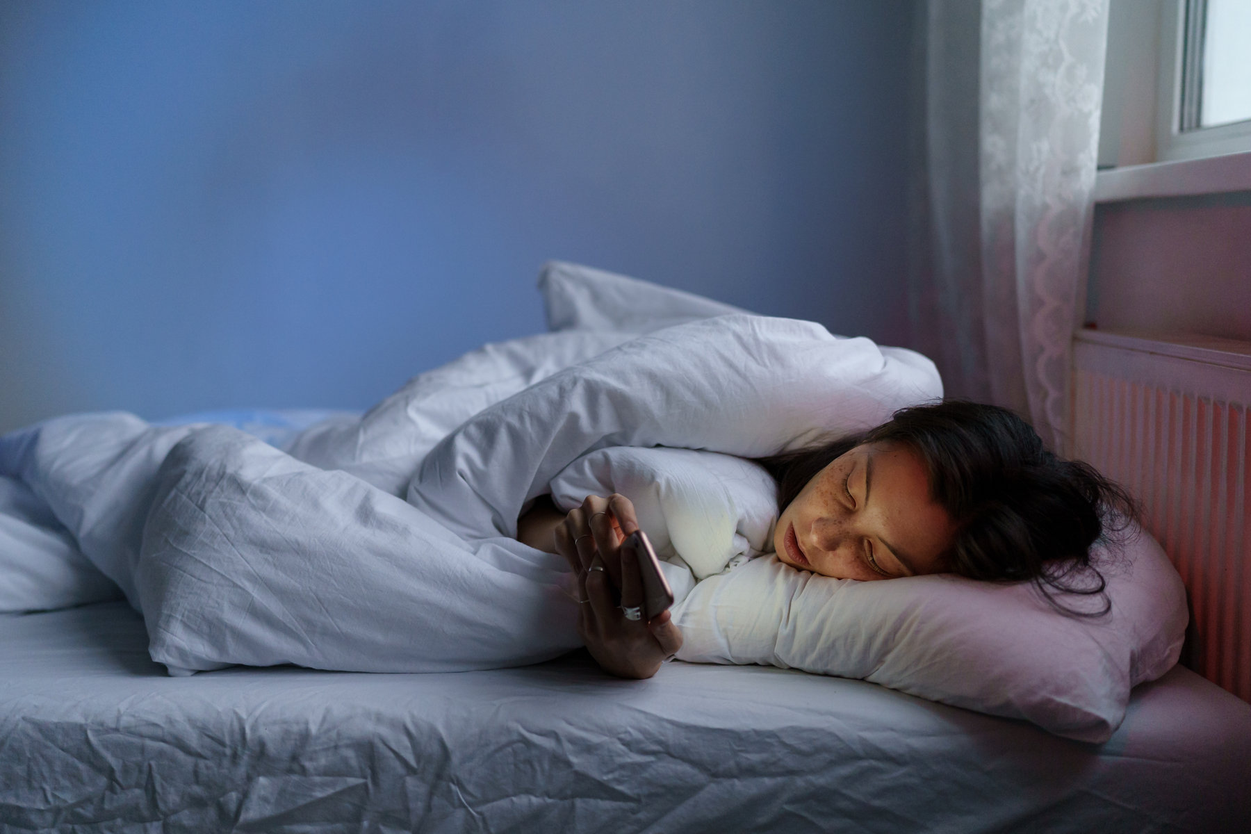 A girl suffering from turmoil and mental health issues caused by social media addiction.